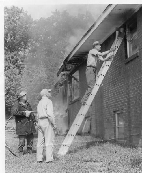 Base of ladder:  Brandon Lloyd,  On the nozzle:  John Rainey Lynch