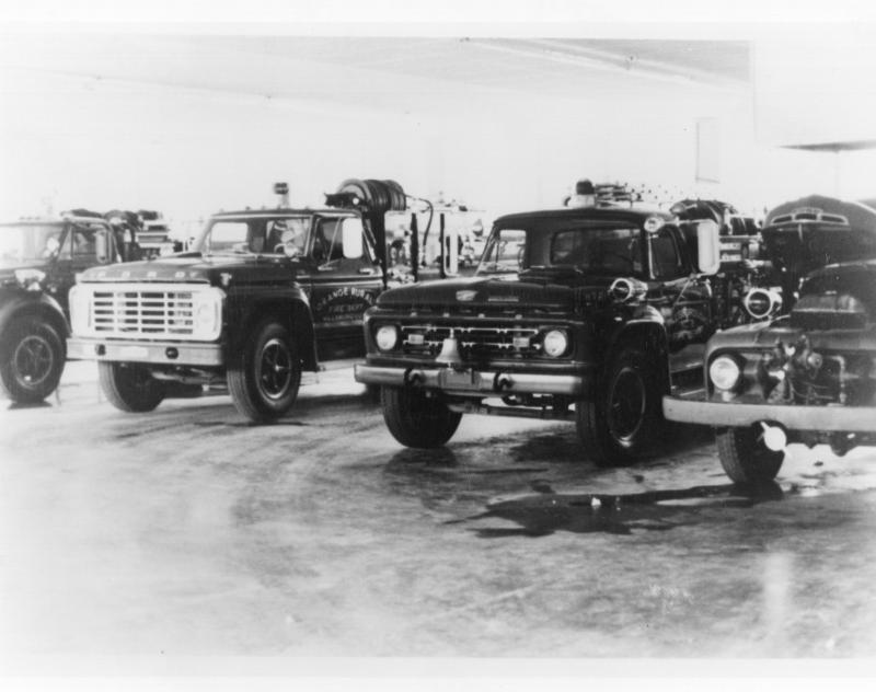 L-R:  1968 Chevrolet, 1972 Ford F-750 John Beam Tanker, 1964 Ford American LeFrance, 1951 Ford